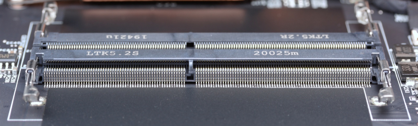 Close-up of two empty SODIMM memory slots on a ThinkPad motherboard